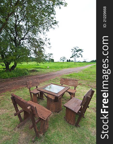Wood recreational chairs and table on garden. Wood recreational chairs and table on garden