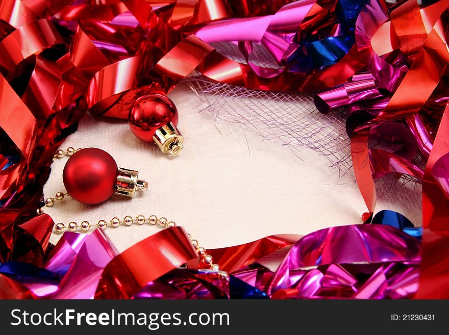 Background for notes with shiny Christmas tinsel and decorations. Background for notes with shiny Christmas tinsel and decorations