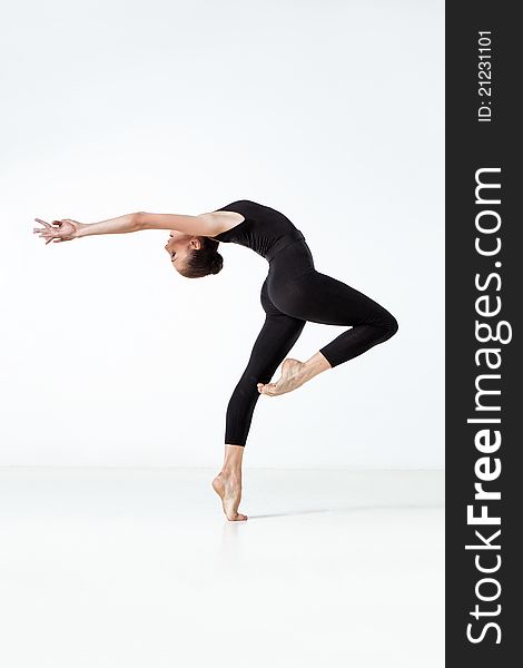 Young and beautiful dancer posing in studio. Young and beautiful dancer posing in studio