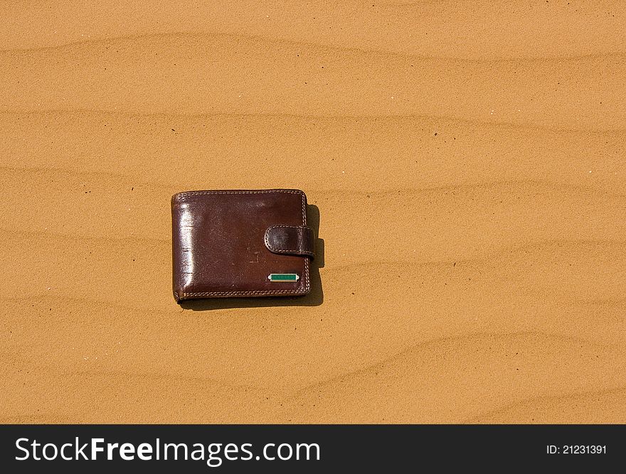 Purse lying on the ground in the desert. Purse lying on the ground in the desert