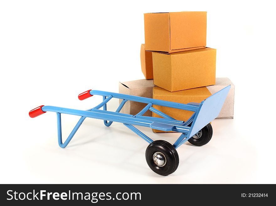 A sack truck and packing boxes on a white background. A sack truck and packing boxes on a white background