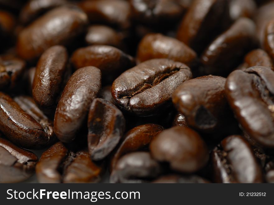 Macro image of caffinated arabica coffee beans. Macro image of caffinated arabica coffee beans.