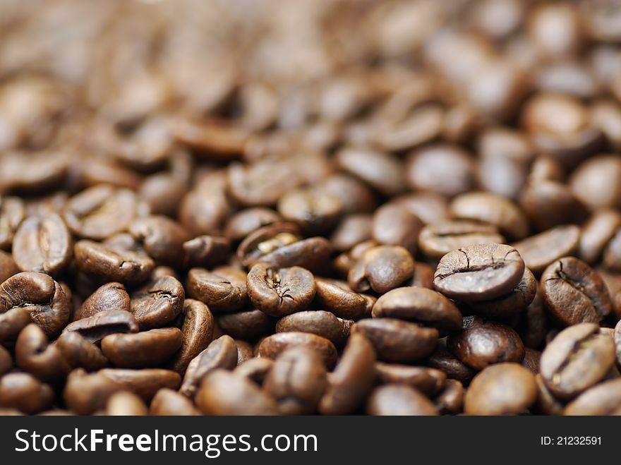Pile of decaffinated coffee beans, short DOF focus on foreground. Pile of decaffinated coffee beans, short DOF focus on foreground.