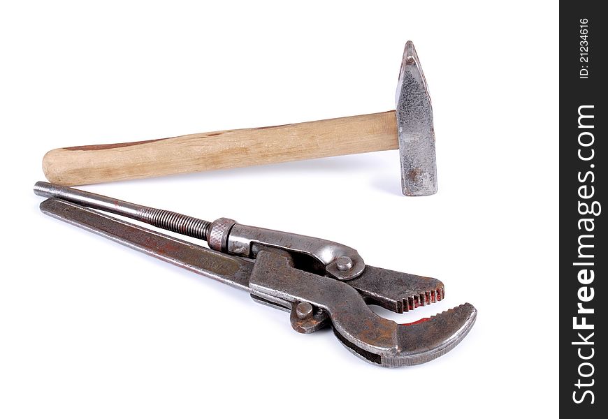 Color photo of a metal wrench and hammer