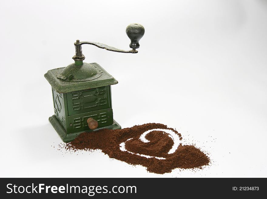 Vintage coffee grinder and ground coffee