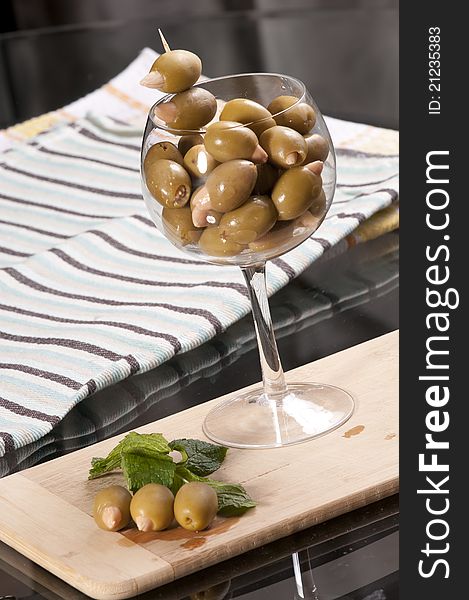 Almond stuffed olives in a wine glass