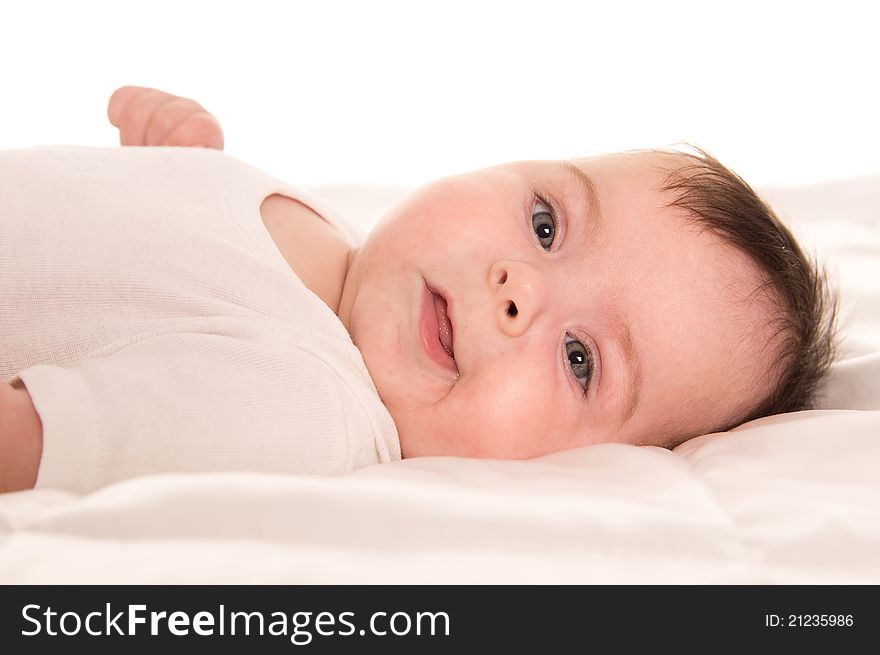 Nice little baby lying on a white. Nice little baby lying on a white