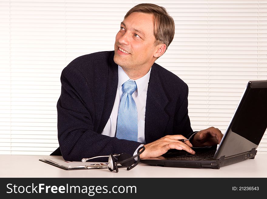 Portrait of a nice man with computer. Portrait of a nice man with computer