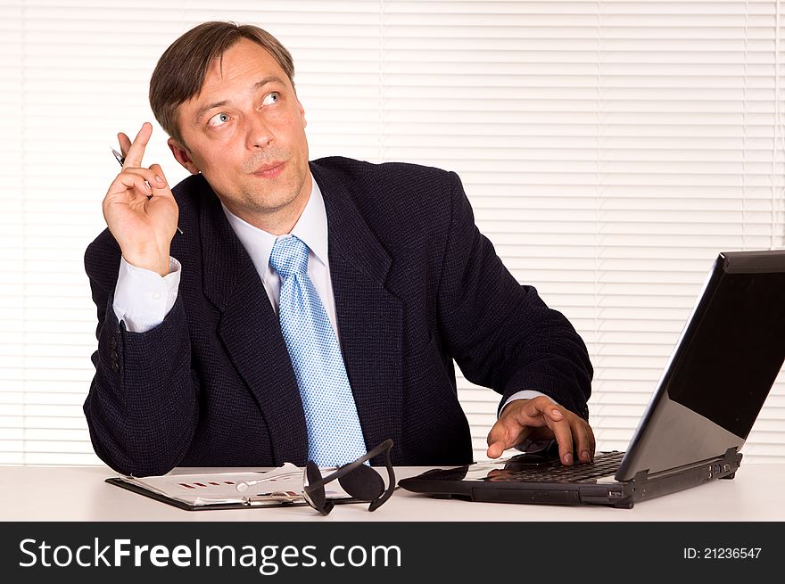 Portrait of a nice man with computer. Portrait of a nice man with computer