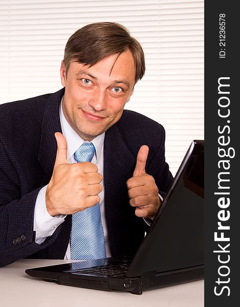 Portrait of a nice man with computer. Portrait of a nice man with computer