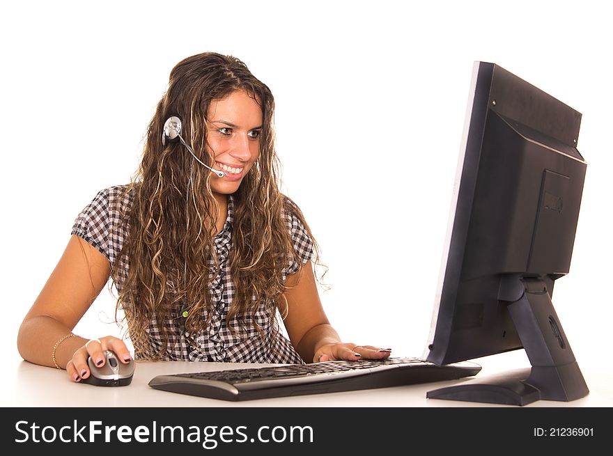 Cute girl posing at computer on white. Cute girl posing at computer on white