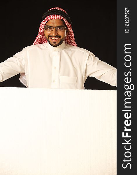 Joyfully happy arab male with ad space. Joyfully happy arab male with ad space