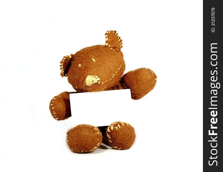 Brown teddy holding white card in white background. Brown teddy holding white card in white background