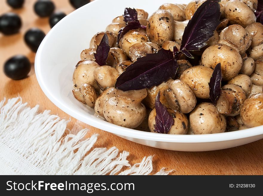 Fried mushrooms in a white bowl