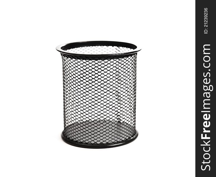 Black basket for pens on white background