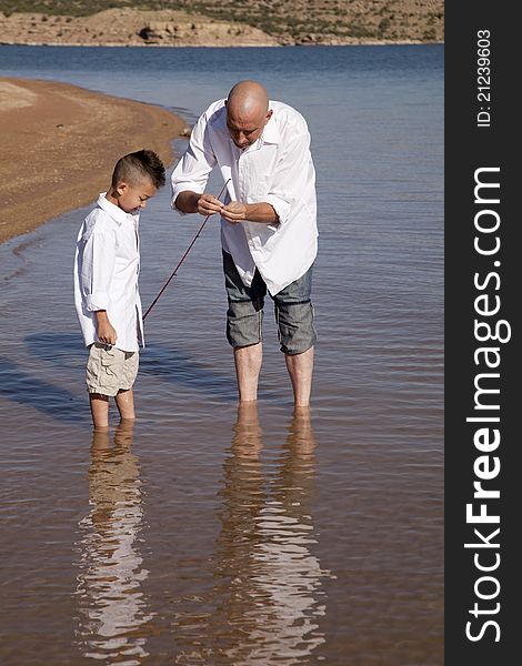 Father teach son to fish