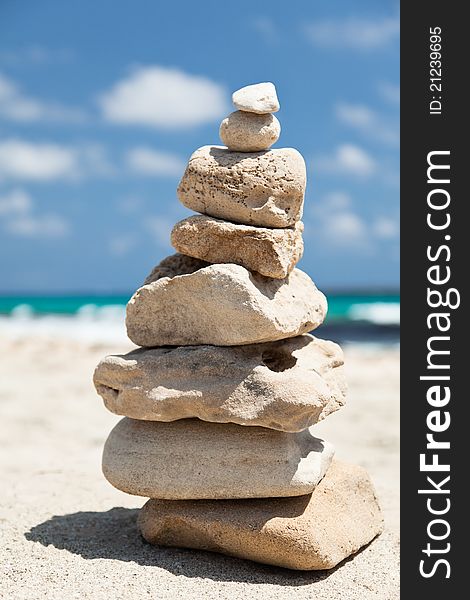 Closeup of stack of pebbles placed on the lonely beach. Closeup of stack of pebbles placed on the lonely beach.