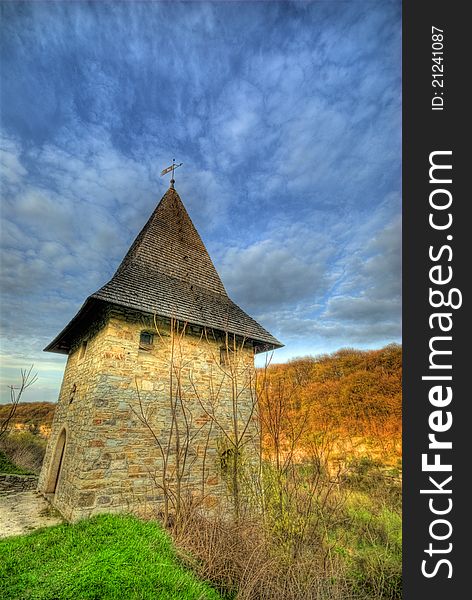 Ancient castle tower with blue sky above