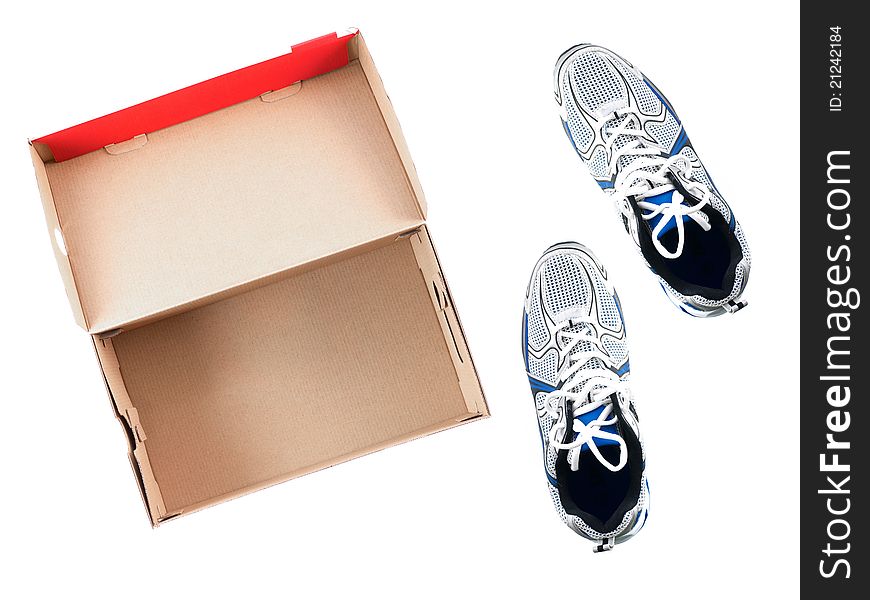 Sports runners situated next to a shoe box