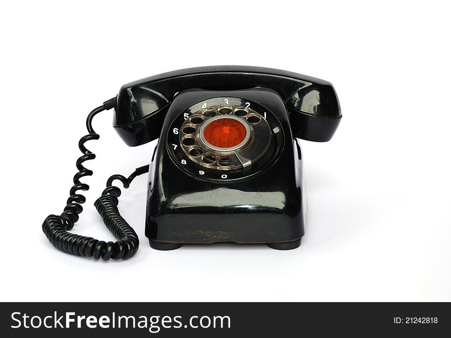 Old Telephone On The White Background