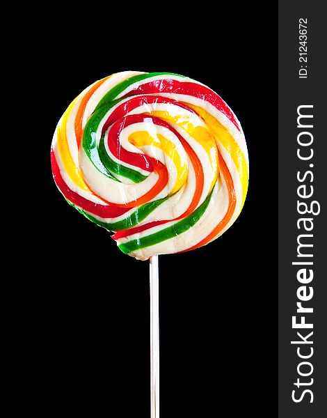 Colorful sweet lollipop. Shot on black background. Colorful sweet lollipop. Shot on black background