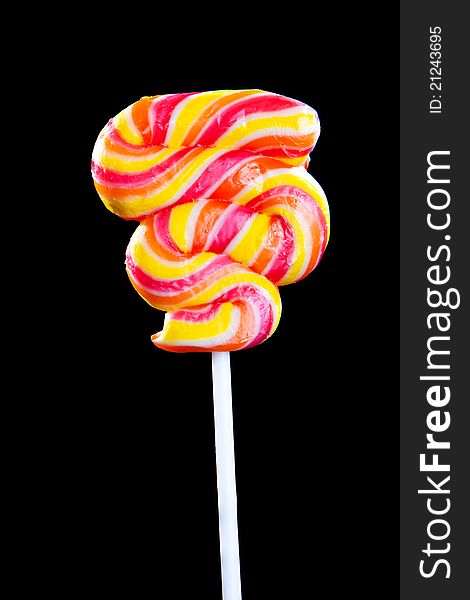 Colorful sweet lollipop. Shot on black background. Colorful sweet lollipop. Shot on black background