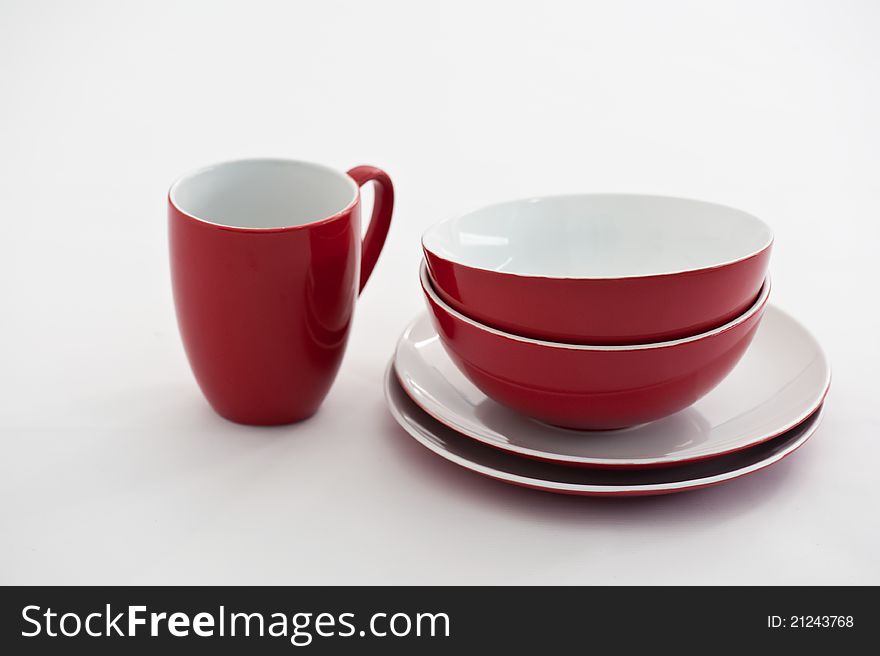Red and white plates, bowls and mug. Red and white plates, bowls and mug