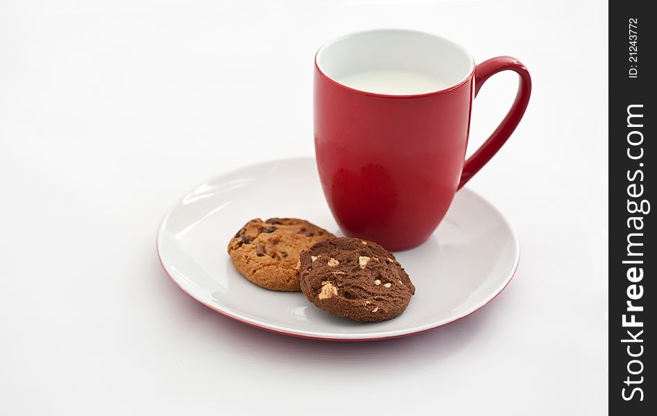 Cookies with milk in red mug