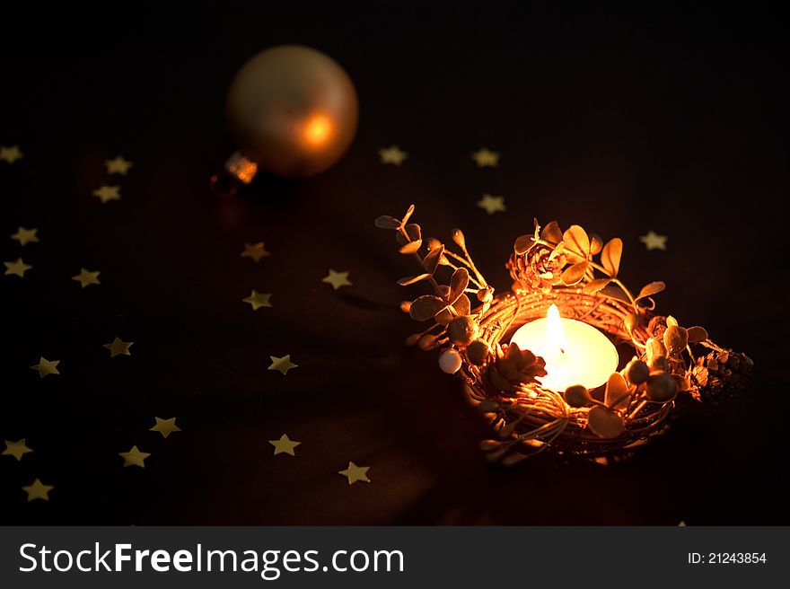 Christmas candle and ball with star confetti