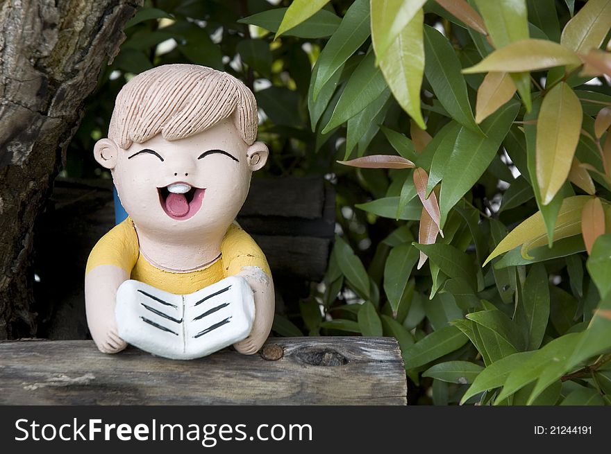 Clay doll in garden