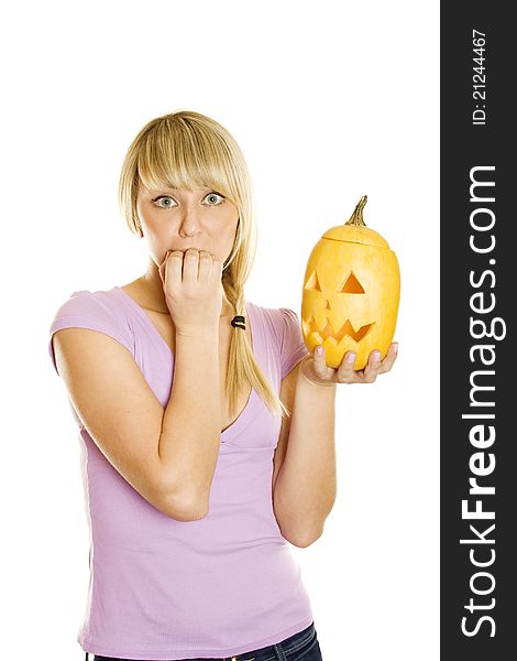 Young woman frightened with pumpkin for Halloween. Lots of copyspace and room for text on this isolate