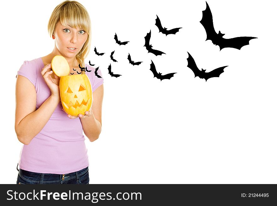 Young woman terrified screams with a pumpkin for Halloween. Lots of copyspace and room for text on this isolate