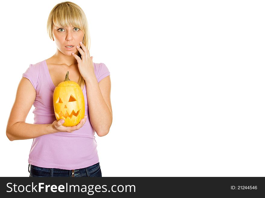 Young woman frightened with pumpkin for Halloween. Lots of copyspace and room for text on this isolate. Young woman frightened with pumpkin for Halloween. Lots of copyspace and room for text on this isolate