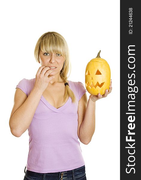 Young woman frightened with pumpkin for Halloween. Lots of copyspace and room for text on this isolate. Young woman frightened with pumpkin for Halloween. Lots of copyspace and room for text on this isolate