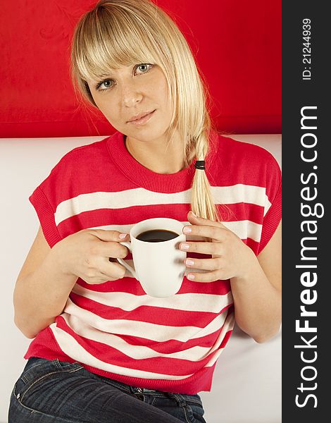 Attractive Young Woman Drinking Coffee At Home