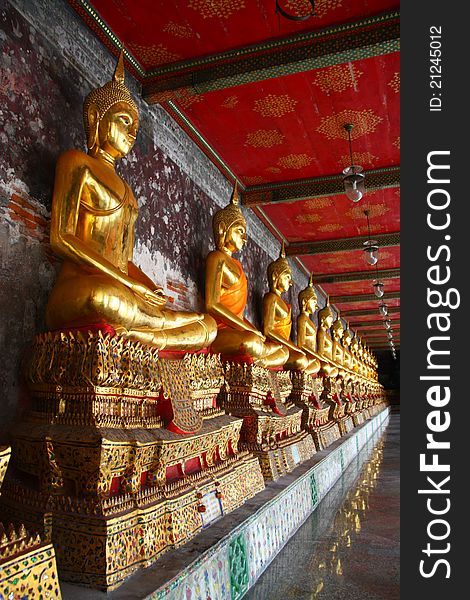 Golden Buddha image at corridor, Wat Suthat temple, Thailand