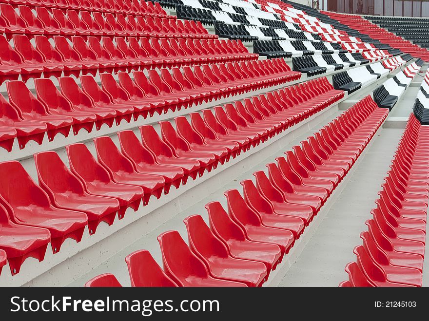 Stadium stands with red, black and white seats. Stadium stands with red, black and white seats