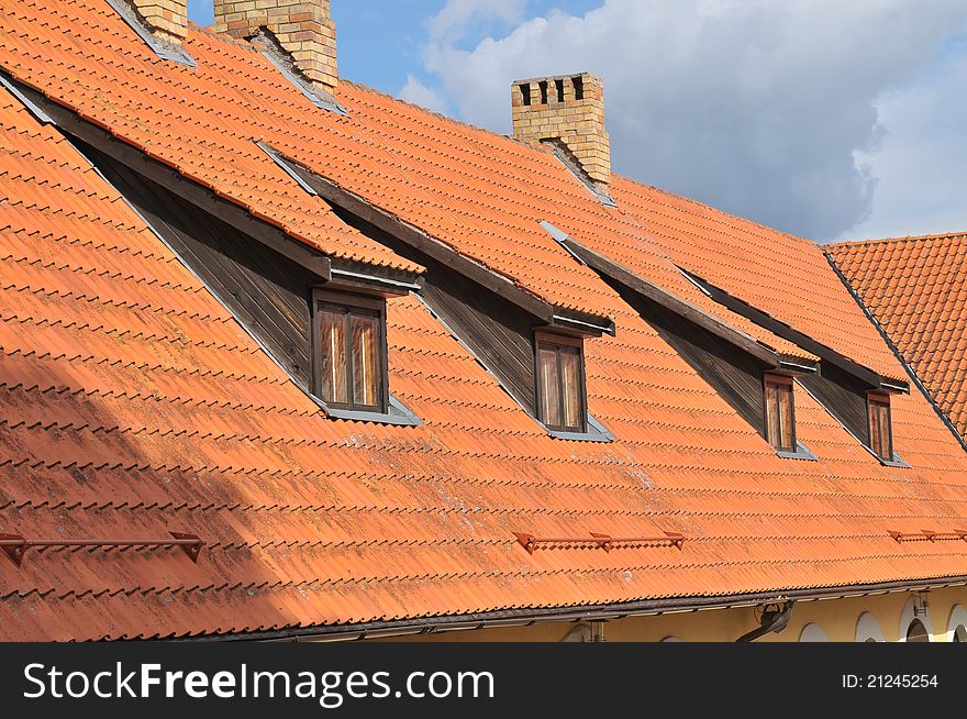 Four windows on the tile roof