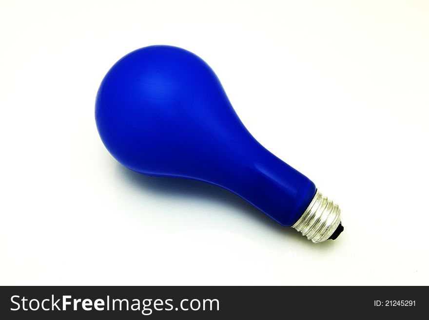 Blue light bulb on a white background. Blue light bulb on a white background