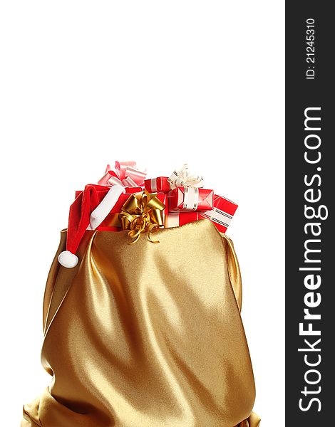 Sack of gold color filled to the brim with Christmas gifts. Isolated on a white background. Sack of gold color filled to the brim with Christmas gifts. Isolated on a white background