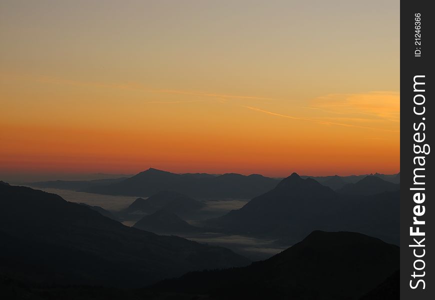 Sunrise over the mountains of canton Lucerne, picture taken from the Brienzer Rothorn.