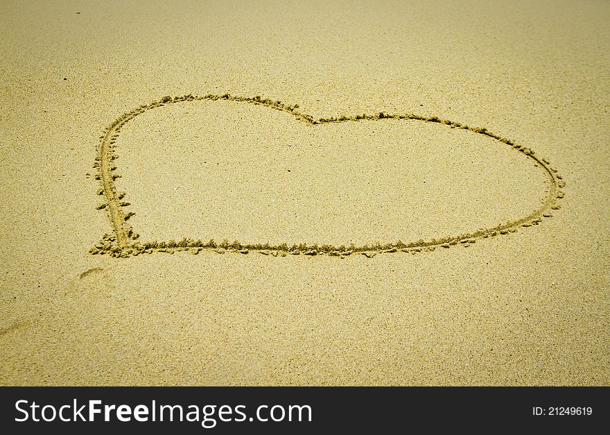 Heart shape in the sand on the beach