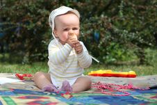 Smiling Boy On The Meadow Eating Pear Stock Photography Smiling Boy On The Meadow Eating Pear Stock Photography