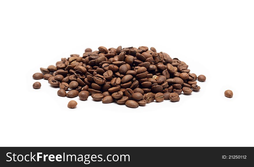 Heap of coffee beans on white background
