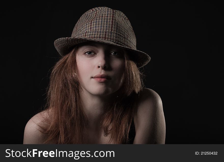 Yung Girl in hat, black Background
