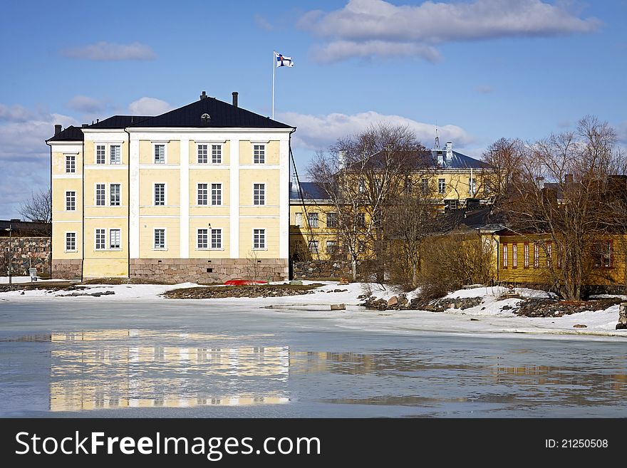 Early spring in Helsinki with partially melted ice of the Baltic Sea and Navy Academy buildings on the Suomenlinna fortress island off shore from Helsinki city. Early spring in Helsinki with partially melted ice of the Baltic Sea and Navy Academy buildings on the Suomenlinna fortress island off shore from Helsinki city.