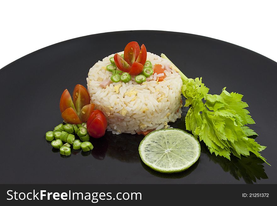 Fried rice on a black dish