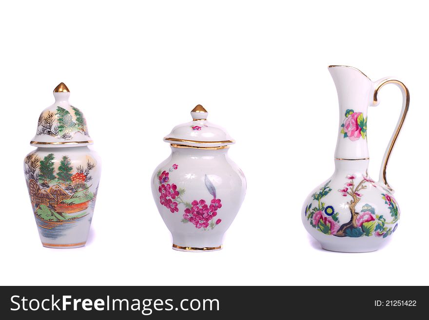 Close up view of some decorative ceramic vases isolated on a white background.