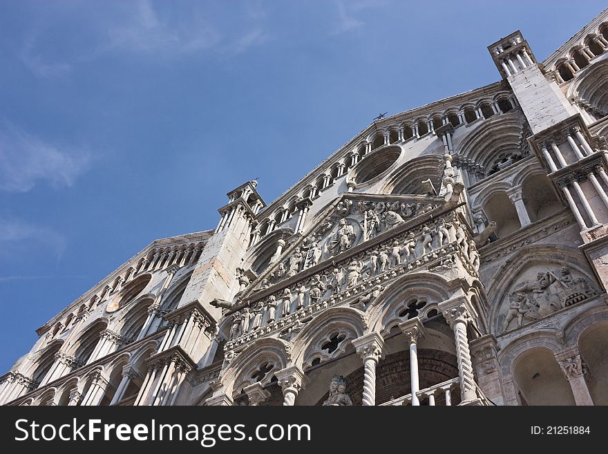 Romanesque facade of Ferrara cathedral - famous catholic landmark in Emilia Romagna, Italy