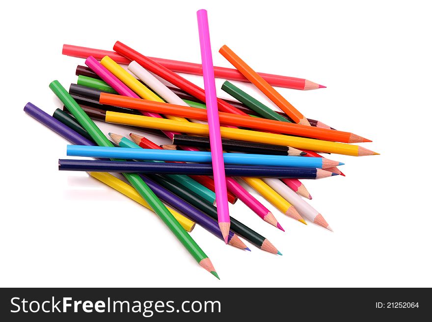 Heap of colored pencils isolated on white background